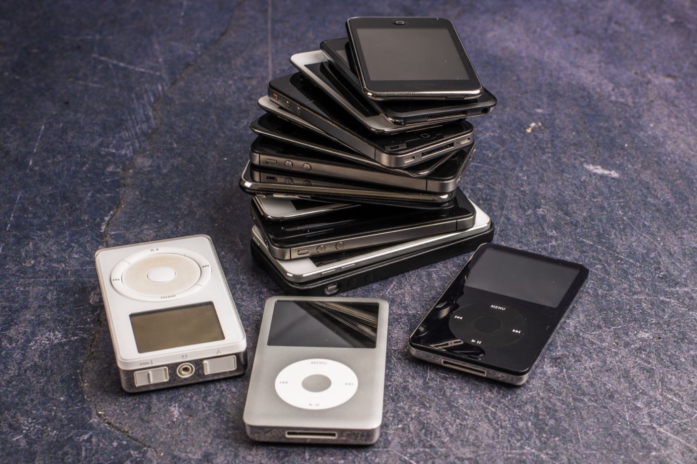 Stack of old iPhones and iPods gathered to sell