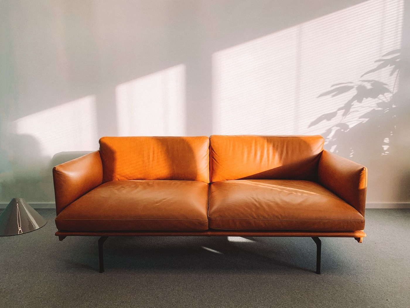Used tan leather couch in a living room